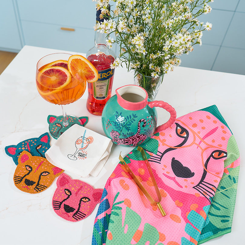 annabel trends microfibre tea towel, cheetah beaded coasters, aperol spritz cocktail napkin and cheetah ceramic jug