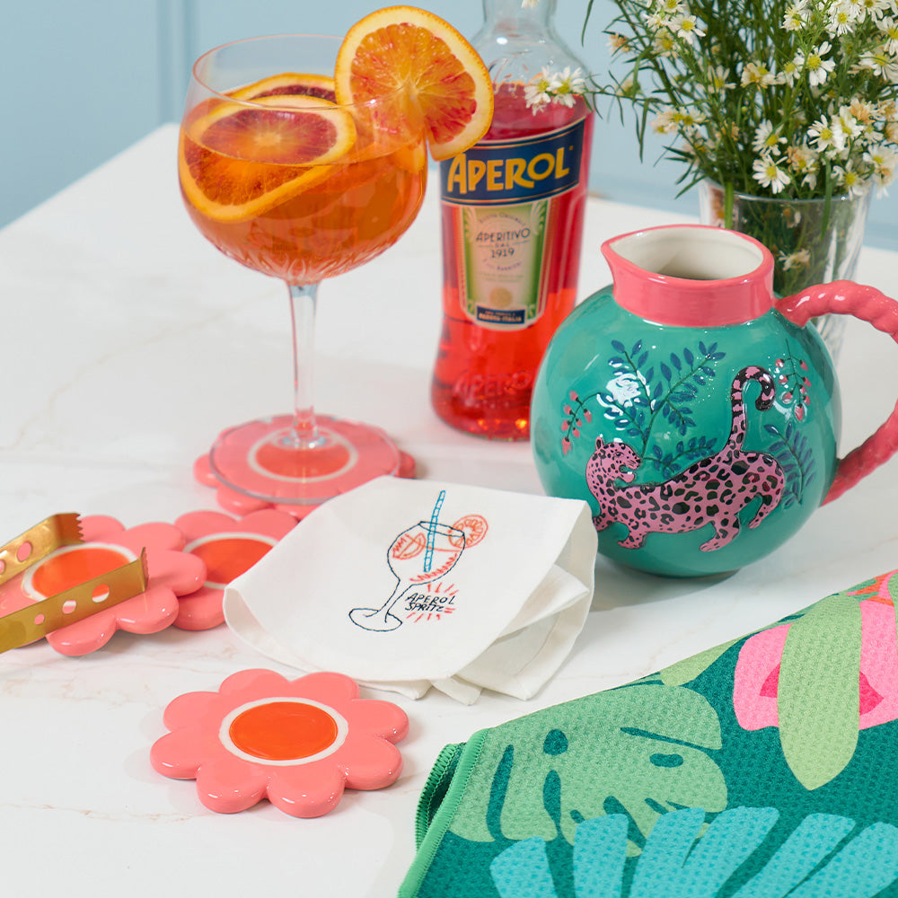 annabel trends flower ceramic coaster, cheetah jug, aperol spritz napkin